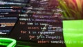 code using loops and assertions on a multi-screen setup, showing modern development and software engineering in action. Royalty Free Stock Photo