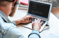 IT coder programmer use laptop computer typing coding on notebook screen Royalty Free Stock Photo