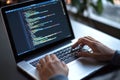 Coding in action: developer programming on a laptop at night for tech projects