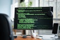 Coding on Computer Monitor in Modern Office Workspace Royalty Free Stock Photo