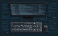 Coding session with keyboard and monitor displaying programming language in a dark environment Royalty Free Stock Photo