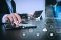 businessman working with smart phone and digital tablet and laptop computer in modern office with glass reflected view Royalty Free Stock Photo