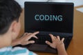 coding. technology and teenagers. child with the word on his laptop screen Royalty Free Stock Photo