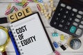 COE - Cost of Equity acronym on notepad, Business and Financial concept Royalty Free Stock Photo