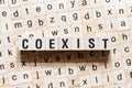 Coexist word concept on cubes Royalty Free Stock Photo