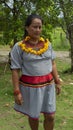 Cofan ethnic woman walking in traditional clothing in the Cofan Dureno millennium community located on the edge of the Aguarico Royalty Free Stock Photo