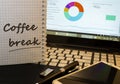 Cofee break in notepad on office working place Royalty Free Stock Photo