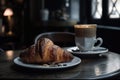 cofee break ritual with a latte and croissant in the old-fashioned cafe