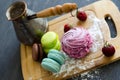 Cofee, marshmallows and macaroons on the cutting board