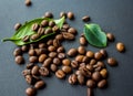 Coffe beans and green leaf on black background Royalty Free Stock Photo