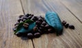 Coffe beans and green leaf Royalty Free Stock Photo