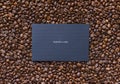 Coffe beans mockup with empty dark paper card for your text or design.