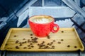Coffe Cup with Beans on Plate Royalty Free Stock Photo