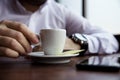 Coffe Cup Held by a Man in the Caffee Bar Royalty Free Stock Photo