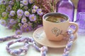 Coffe cup with purple and lilac violet autumn flower Royalty Free Stock Photo