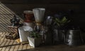 Coffe drip set with,roasted beans,kettle,grinder,white cup and flower pot on wood table and background Royalty Free Stock Photo