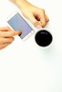 Coffe with mobile on white background Royalty Free Stock Photo