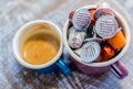 Coffe pods in enamel mug Royalty Free Stock Photo