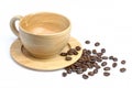 Empty wooden cup of black coffee with roasted coffe beans isolated on white Royalty Free Stock Photo