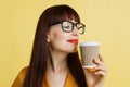 Coffee addict, coffee break, good morning. Close up horizontal shot of pretty young business woman in spectacles and