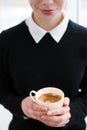 Coffee addict young girl holding cup hot drink
