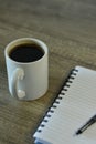 Coffee along a notepad for business man