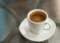 Coffee americano on the glass table, close up shot