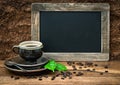 Coffee, antique blackboard, coffee leaves and beans. retro style