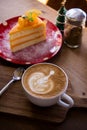 coffee aroma latte art cup and tasty christmas cake on wood table relaxtime in cafe coffee shop Royalty Free Stock Photo