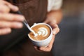 Coffee Art In Cup. Closeup Of Hands Making Latte Art Royalty Free Stock Photo