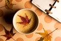 Coffee with autumn leaf on a table Royalty Free Stock Photo