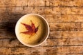 Coffee with autumn leaf on a table Royalty Free Stock Photo