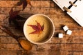 Coffee with autumn leaf on a table Royalty Free Stock Photo