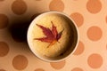 Coffee with autumn leaf on a table Royalty Free Stock Photo
