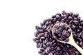 Coffee background. Heap roasted coffee beans spread over on tabl