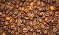 A mixture of different types of roasted coffee beans in bulk. Royalty Free Stock Photo