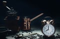 Coffee background of vintage alarm clock at 8 o`clock with a cup of hot coffee, coffee grinder and coffee mug on table with Royalty Free Stock Photo