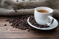 Coffee bag and heart from coffee beans on table Royalty Free Stock Photo