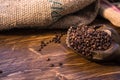 Coffee bag and heart from coffee beans on table Royalty Free Stock Photo