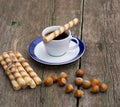 Coffee, baking in the form of tubules and nutlets, on a wooden t