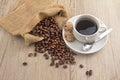 Coffee bean with a cup of kopi Royalty Free Stock Photo