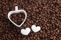 Coffee bean and heart shape cup on coffee bean background. For valentine day. Royalty Free Stock Photo