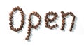 Coffee bean lettering close-up top view on white background. brown arabica coffee beans Royalty Free Stock Photo