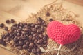 Coffee bean with love heart on wood sack Royalty Free Stock Photo