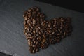 Coffee bean love shape on a slate. Royalty Free Stock Photo
