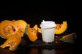 Coffee bean pumpkin spice latte nutrition recipie mock up. cut pumpkin coffee beans and white paper cup for coffee break with a