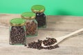 Coffee bean with view of the coffee jar and Heab Royalty Free Stock Photo