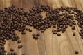 Coffee Beans on Zebrano wood table top Royalty Free Stock Photo