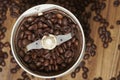 Coffee Beans and grinder on Zebrano wood table top Royalty Free Stock Photo