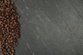 Coffee beans along a slate board